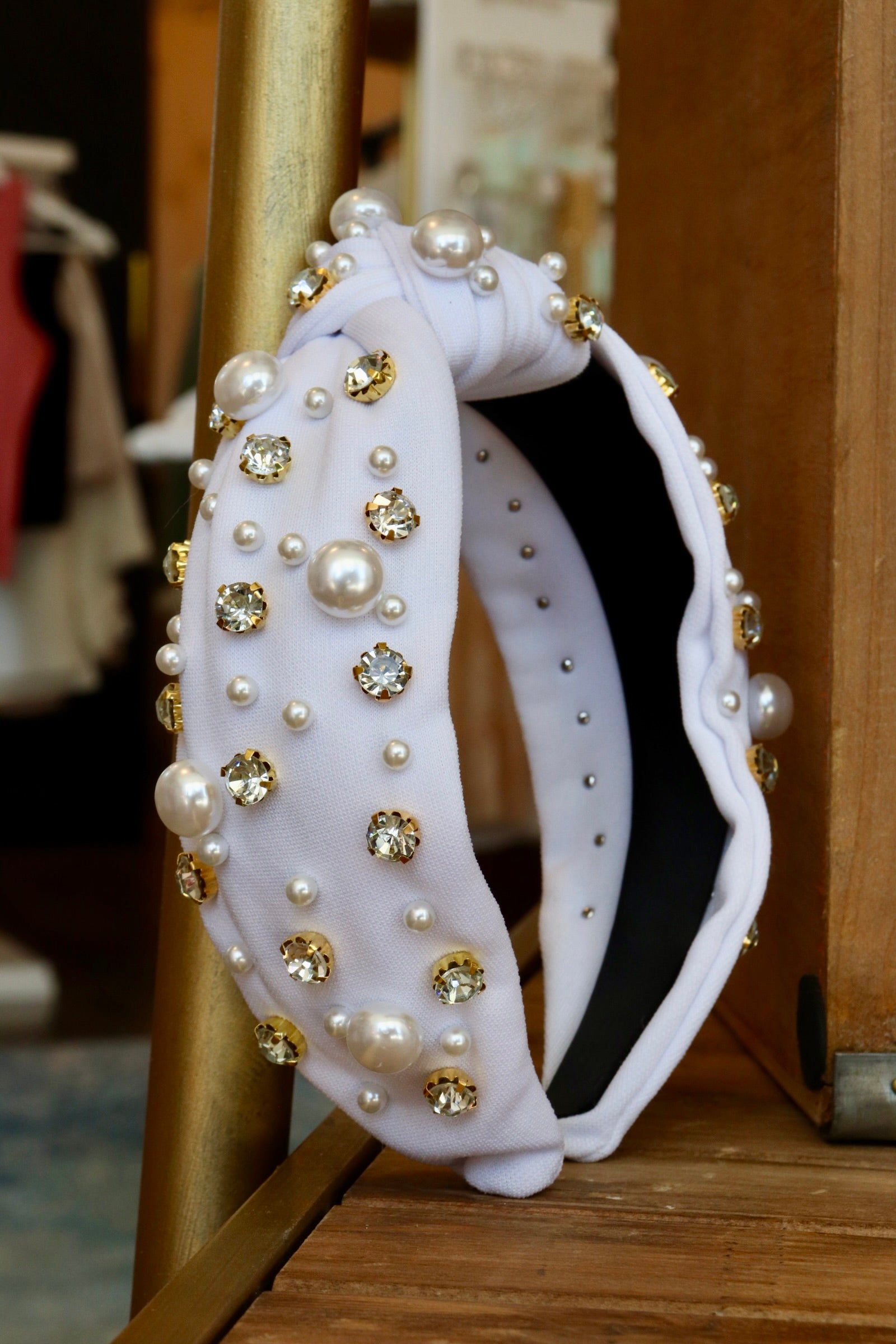 thick white knotted headband with pearl and jewel detailing