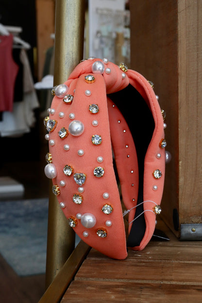 thick orange knotted headband with pearl and jewel detailing